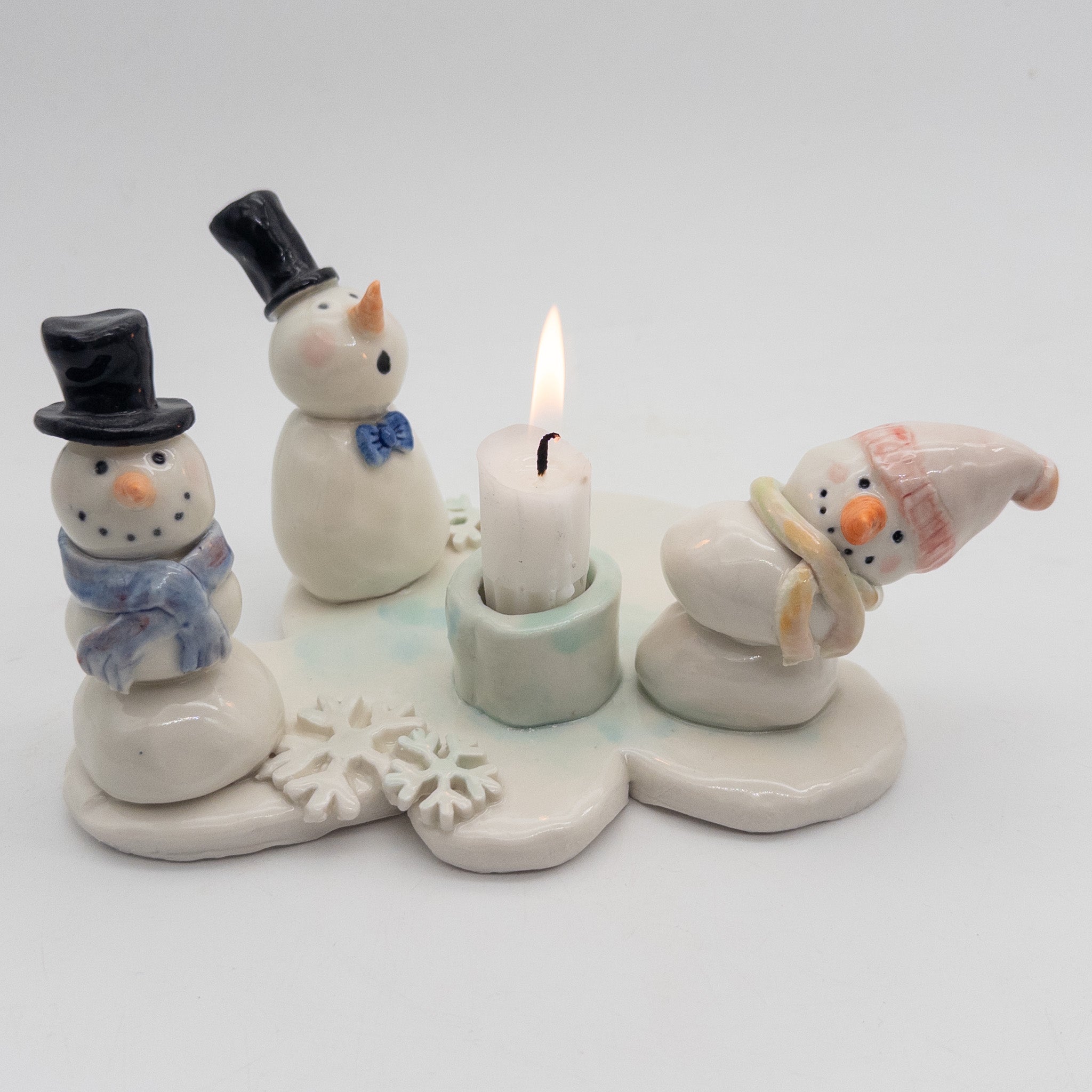 Lysestage med snemænd