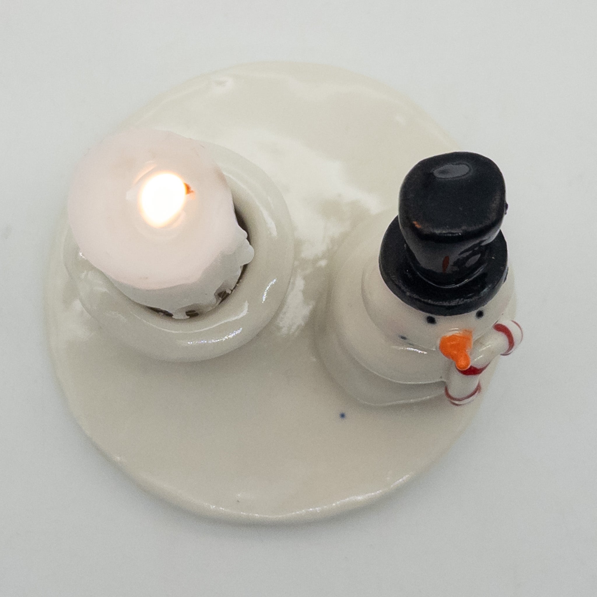 Lysestage med snemand