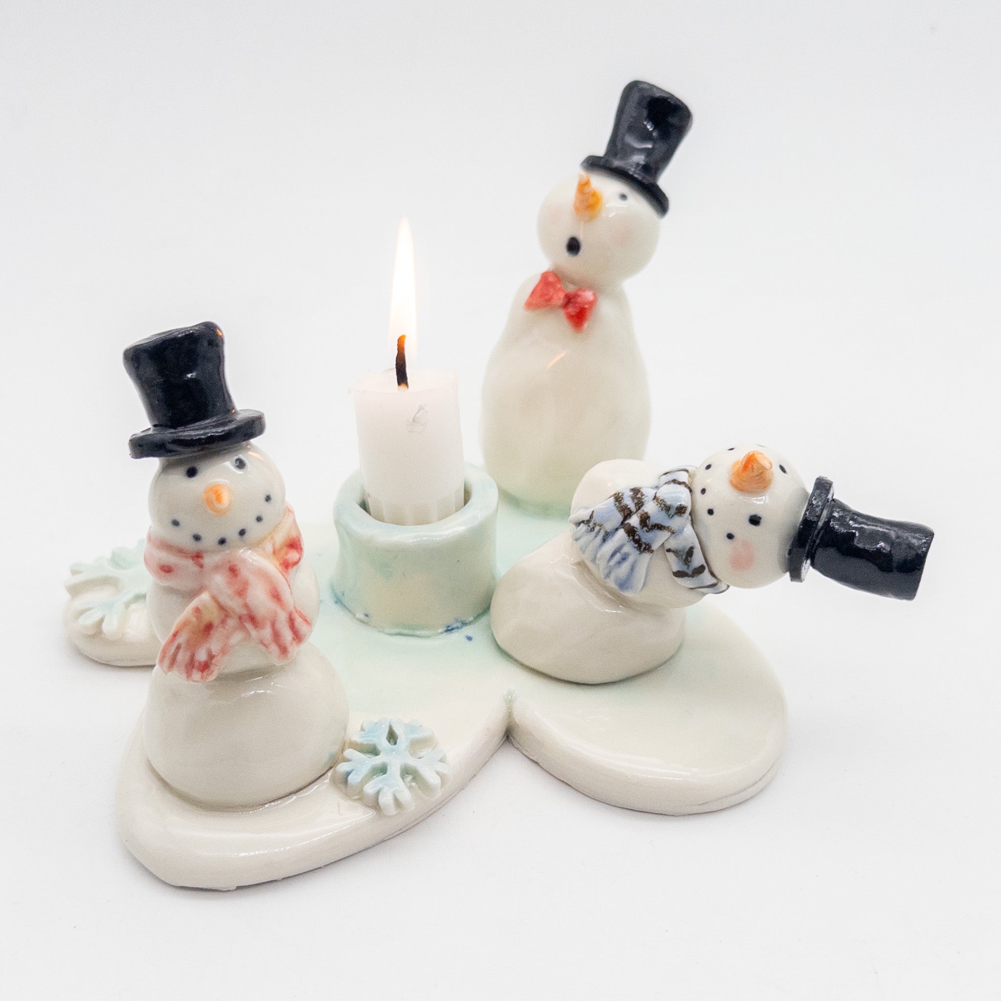 Lysestage med snemænd