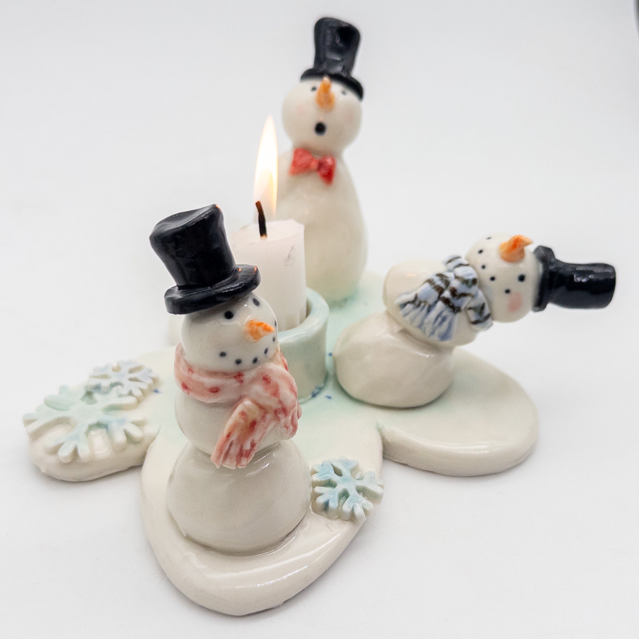 Lysestage med snemænd