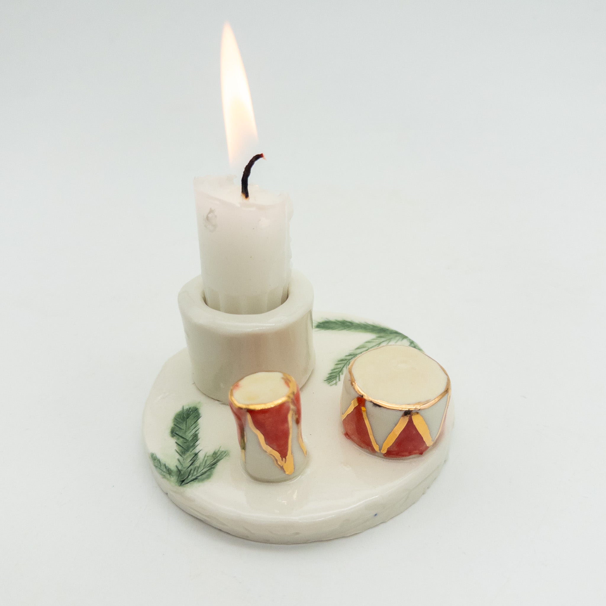 Lysestage med juletrommer