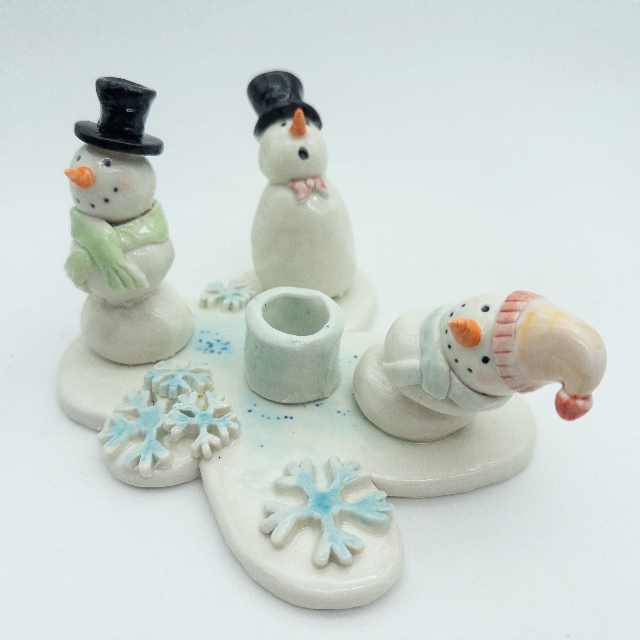 Lysestage med snemænd