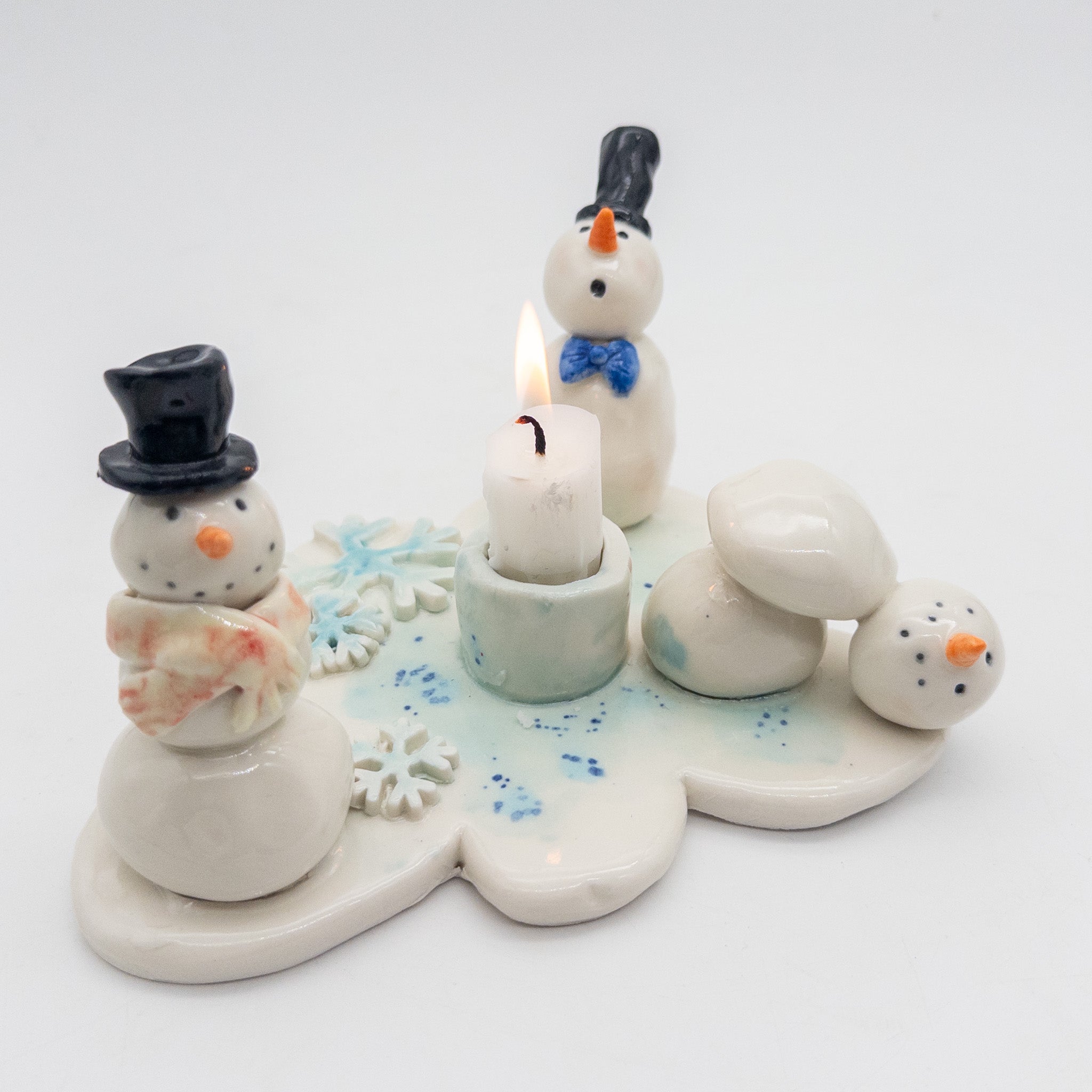 Lysestage med snemænd