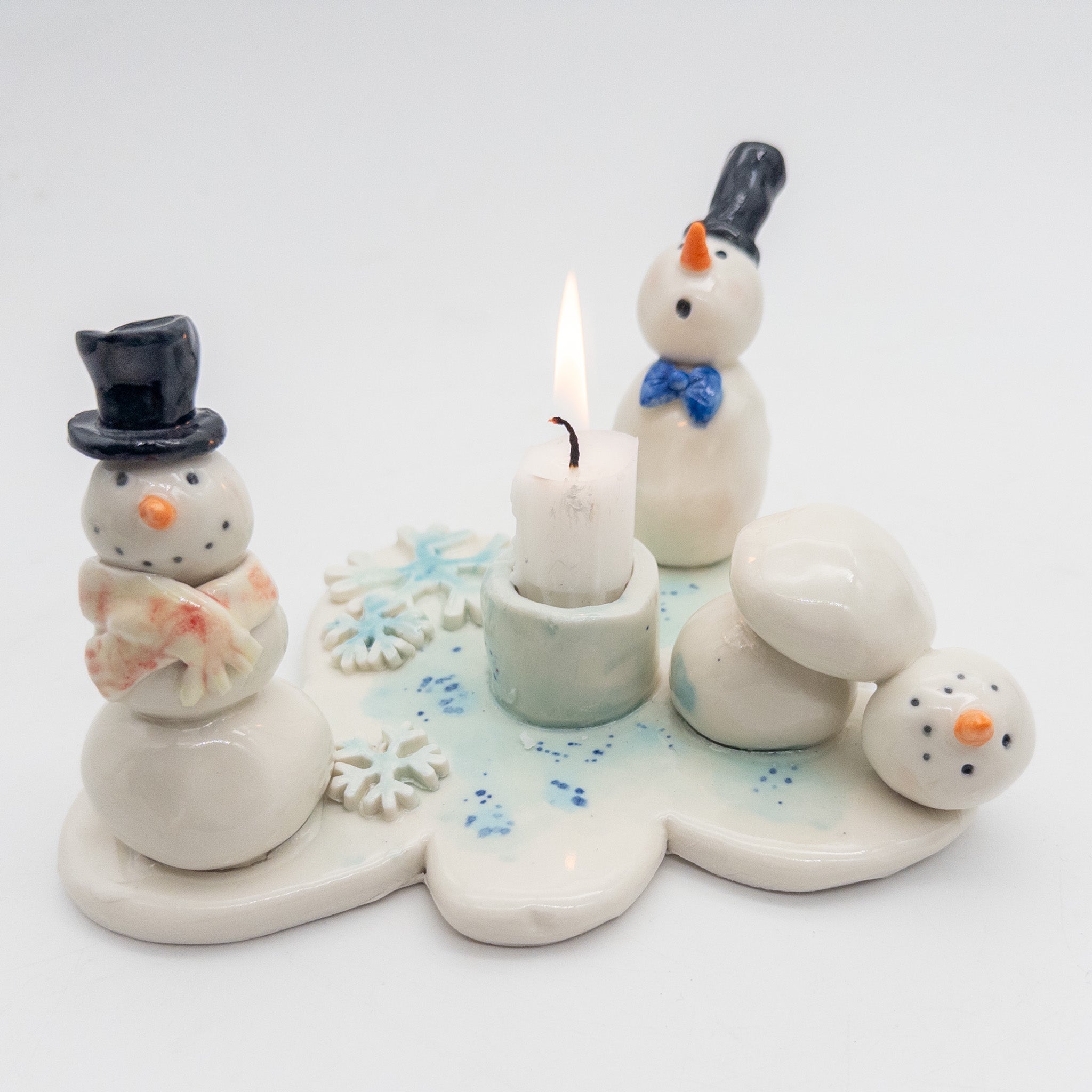 Lysestage med snemænd