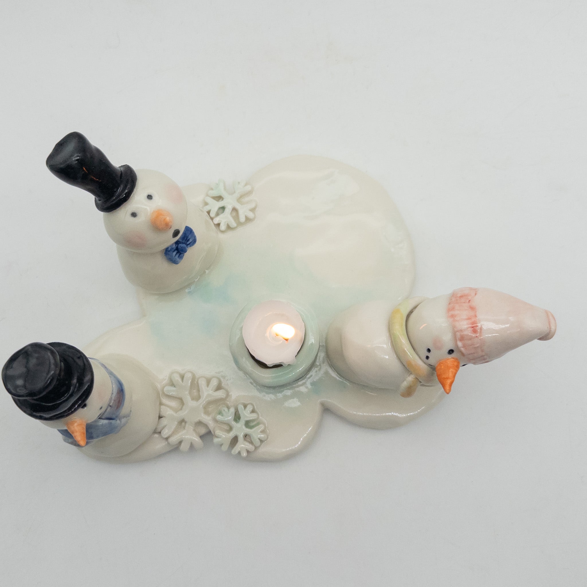 Lysestage med snemænd