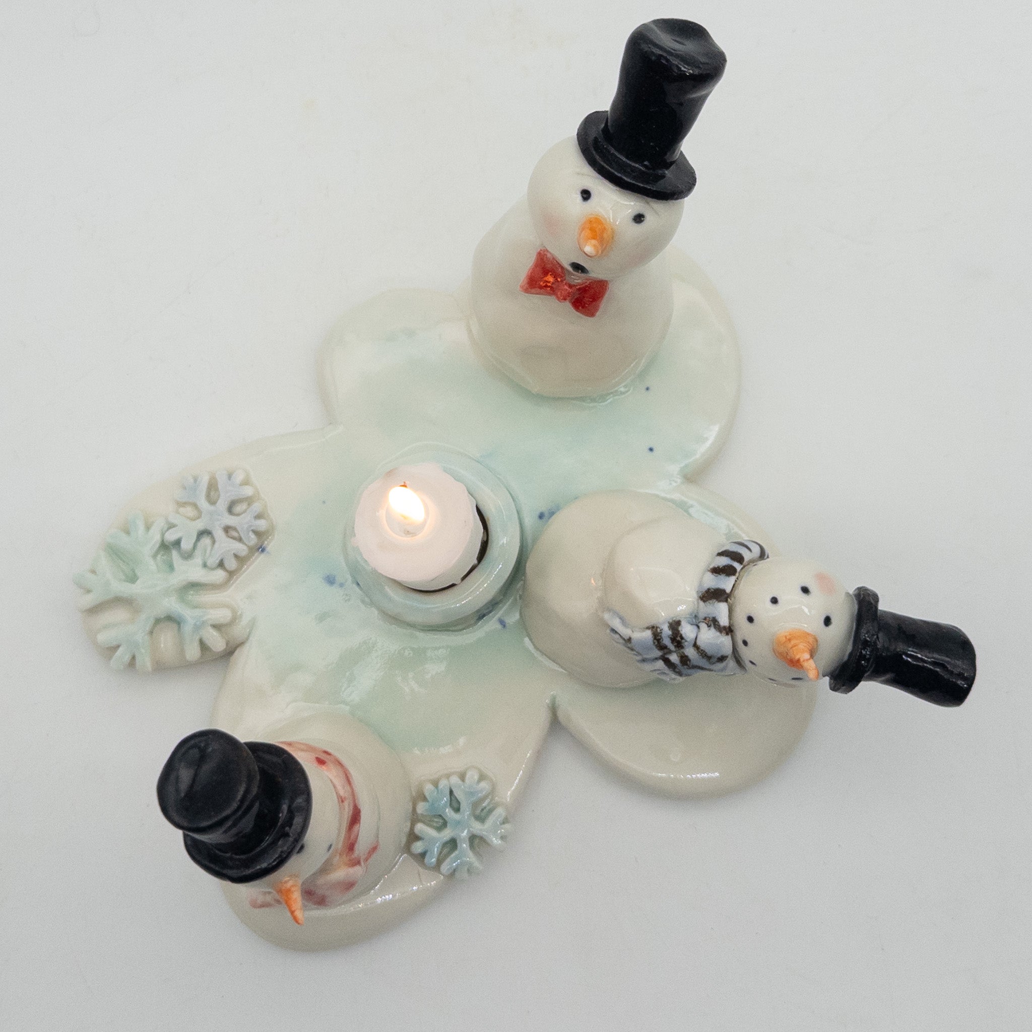 Lysestage med snemænd