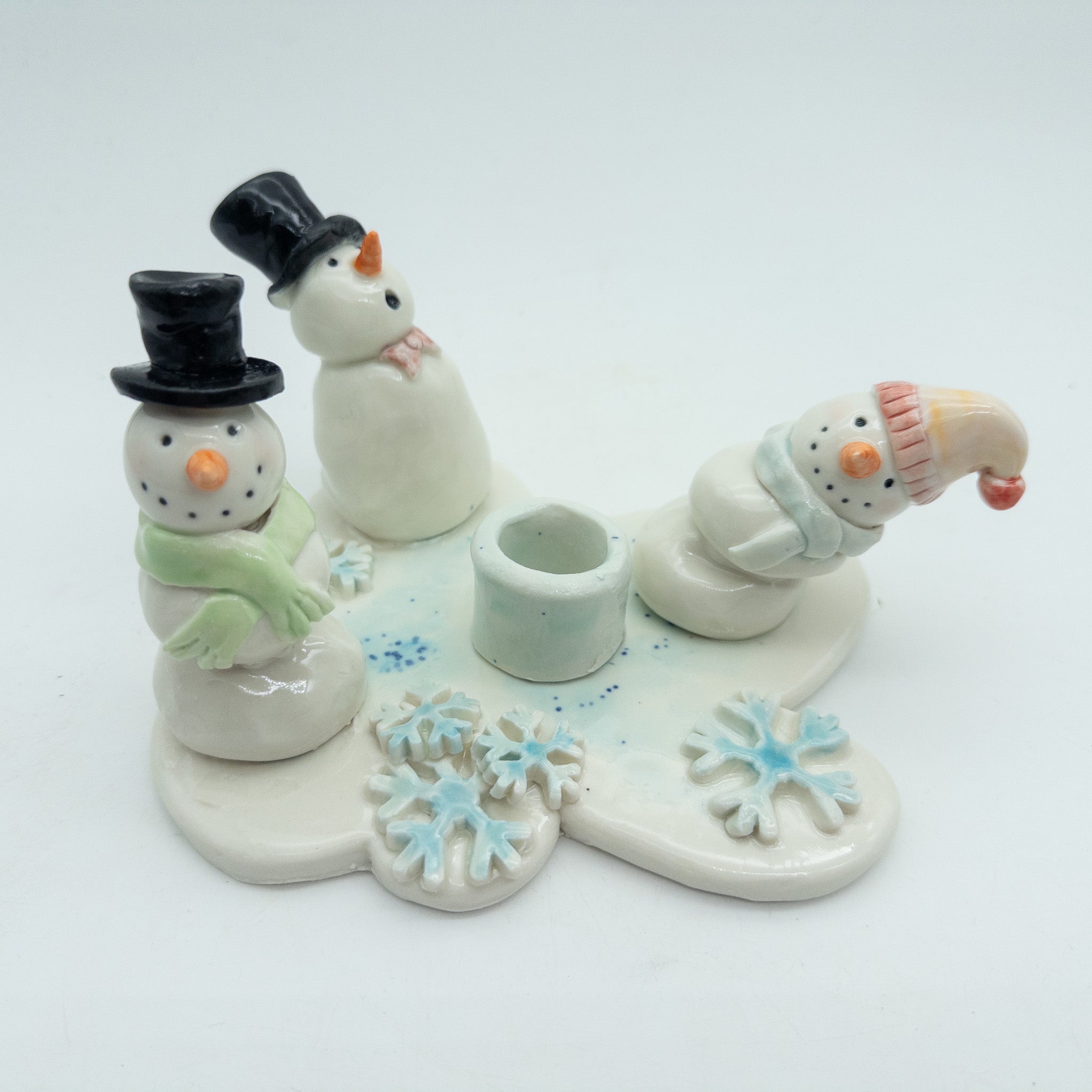 Lysestage med snemænd